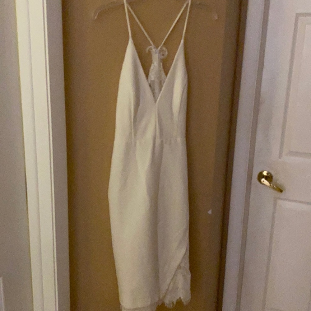 Beautiful off white dress. Never worn with tag.
